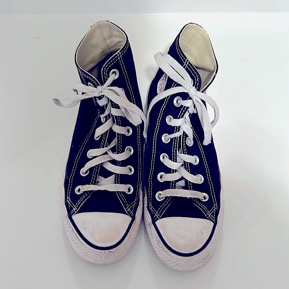 Women’s size 7 black high top converse all stars.